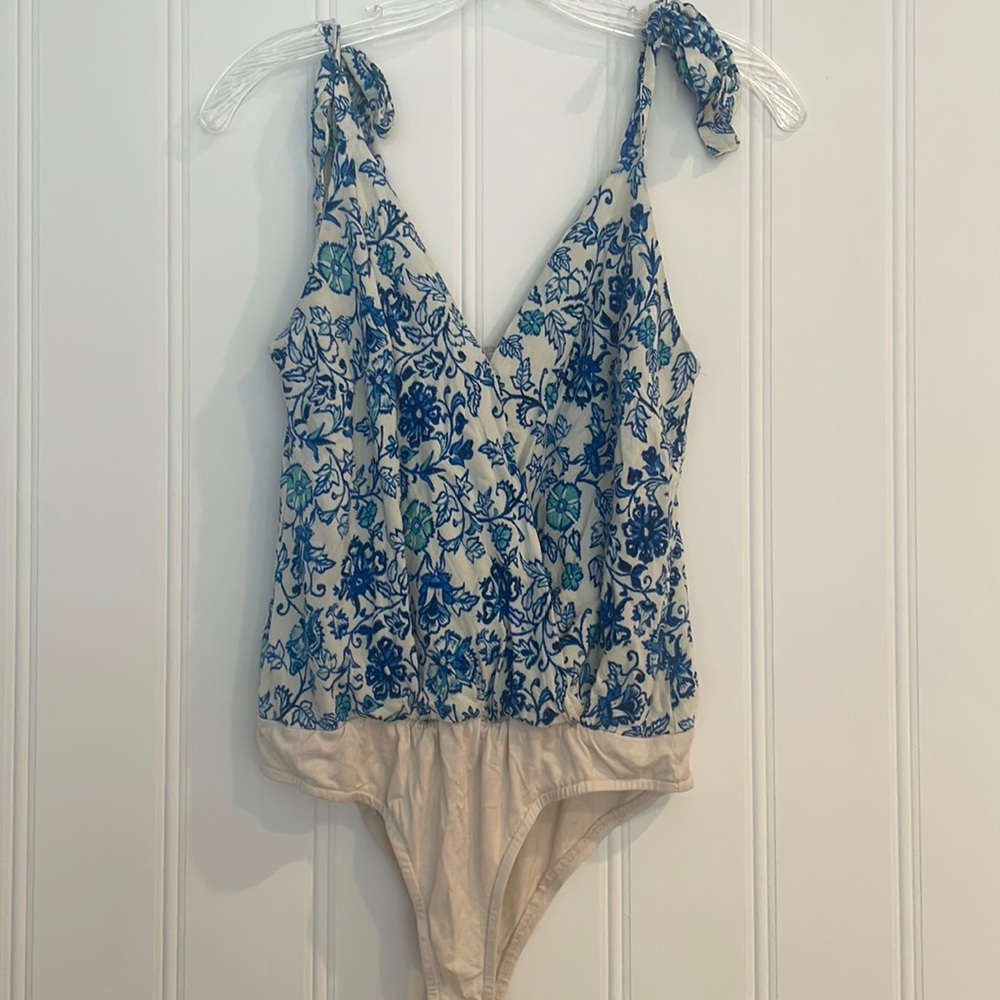 Size small blue and white body suit.